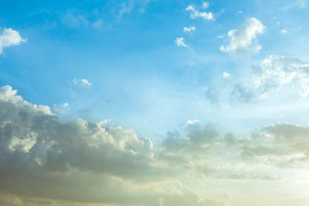 Sunlight and burst explode in cloudy blue sky clouds backgroundの写真素材