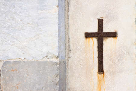 Iron cross snuggled in stoneの写真素材