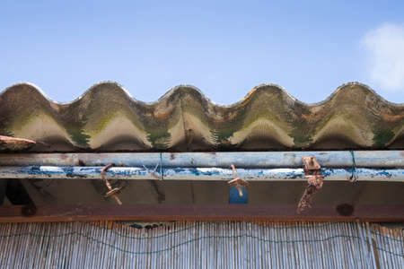 Dangerous asbestos roof - Medical studies have shown that the asbestos particles can cause cancerの写真素材