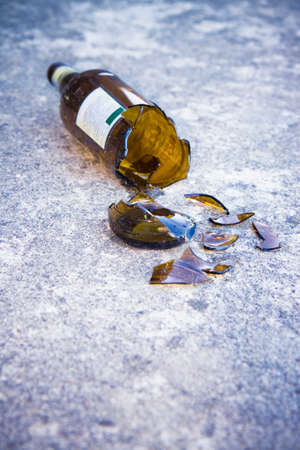 Shattered brown beer bottle: alcoholism conceptの写真素材