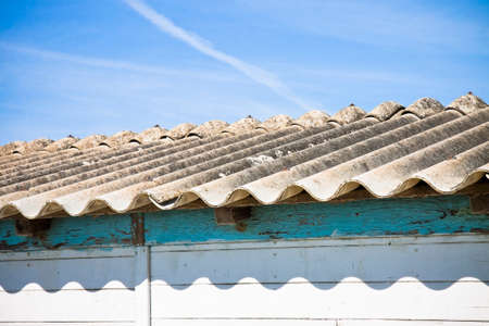 Dangerous asbestos roof - Medical studies have shown That the asbestos particles can cause cancerの写真素材