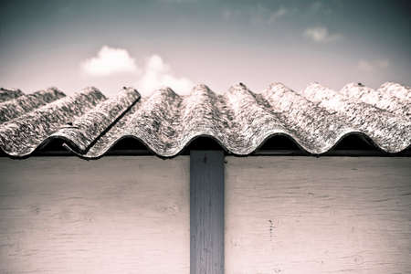 Dangerous asbestos roof - Medical studies have shown that the asbestos particles can cause cancer -toned imageの写真素材
