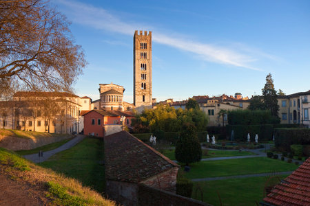 Panoramic view of Lucca with the San Frediano church in background at sunset - Tuscany - Italyのeditorial素材