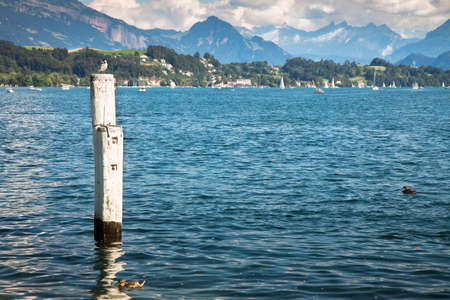 View of Lucerne View of Lucerne Lake.In the foreground you can see a pole for mooring boatsの写真素材