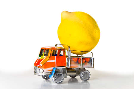 Small lorry loaded with one big lemon - concept imageの写真素材