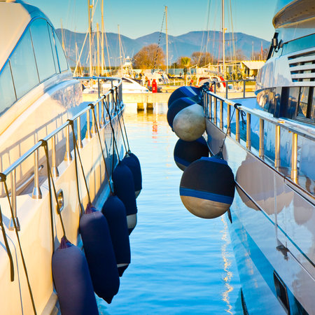 Bumpers protection between two boats - New Marina di Pisa's harbor (Italy - Tuscany)のeditorial素材