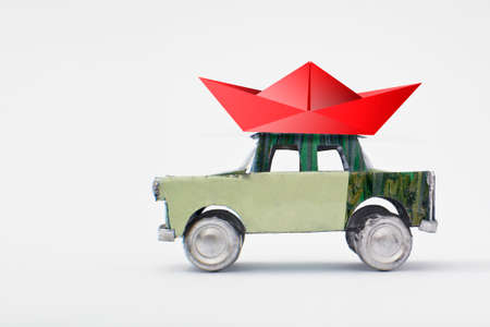 Little red boat on a model car - holidays  conceptの写真素材