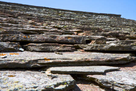 Detail of a slate roof of a house in the Italian mountainsの写真素材