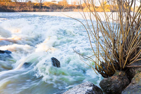 River in flood after several days of rain with copy spaceの写真素材