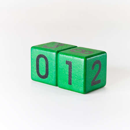 Number one written on a wooden green cubeの写真素材