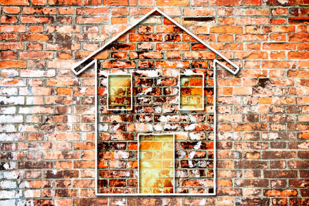 Silhouette of a colored house on a brick wall background