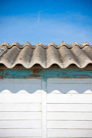 Dangerous asbestos roof - Medical studies have shown that the asbestos particles can cause cancerの写真素材