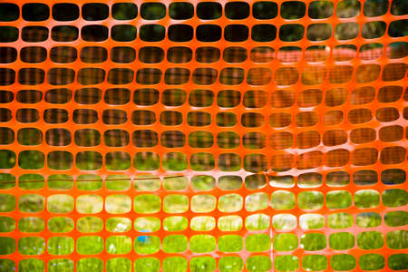 Orange construction grid around a construction site