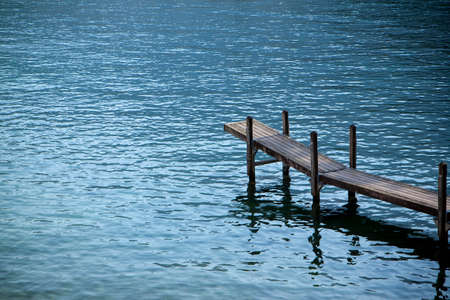 Wooden pier by the lake: silent place conceptの写真素材