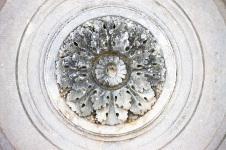 Detail of a carved circular stone flowerの写真素材