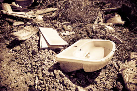 Illegal dumping: education and rudeness concept - toned imageの写真素材