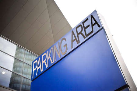 Parking area signage on blue background の写真素材
