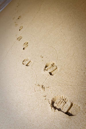 Shoe footprints in the sand - vignette addedの写真素材