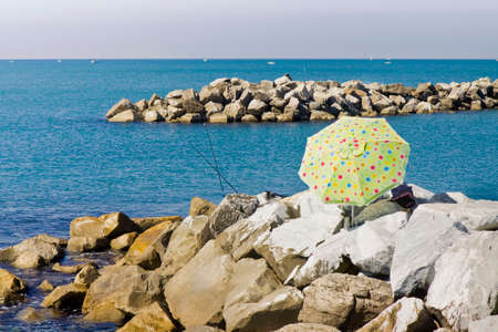 Colored beach umbrella against the sea