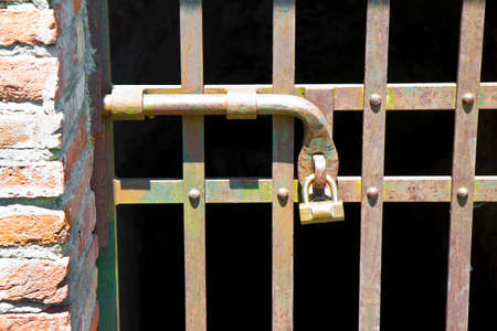 Metal gate closed with metal pole - concept imageの写真素材