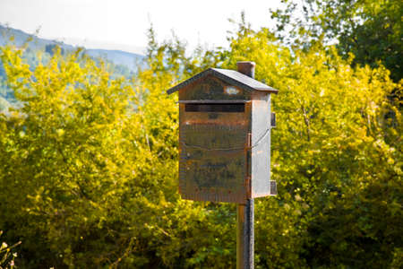 Old metal mailbox in the countryside. New ways of communication - concept imageの写真素材