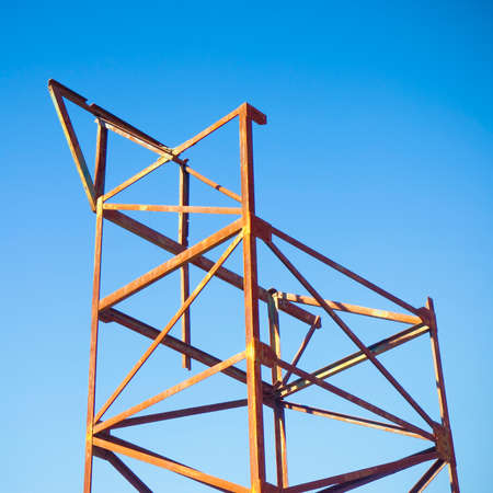 Old iron structure on blue background - image with copy spaceの写真素材