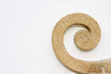 Detail of an old stone frame against a white plaster wall - image with copy spaceの写真素材