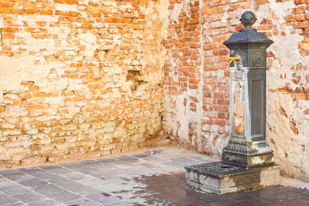 Drink fountain in public space of an italian city - image with copy spaceの写真素材