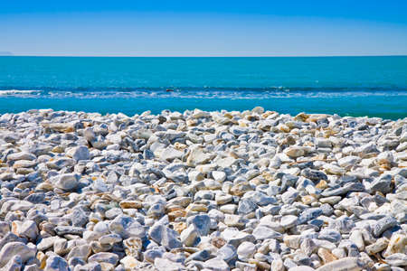 White and gray stones softly rounded against a blue skyの写真素材