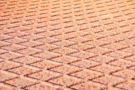 Old antislip corrugated and rusty metal plateの写真素材