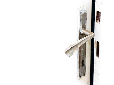 Old door handle on a white background - image with copy spaceの写真素材