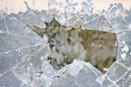 Old damaged glass reinforced with wire mesh