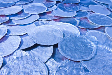 Thermosealed aluminum cover for yoghurt overlapped to each other - toned imageの写真素材