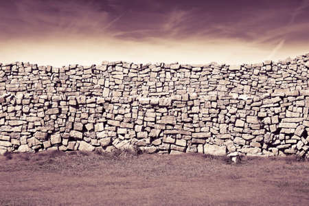 Typical Irish wall to divide pastures (Ireland) - toned image