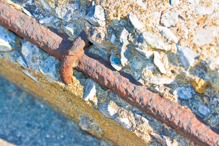 Old reinforced concrete structure with damaged and rusty metallic reinforcement  that must be demolishedの写真素材