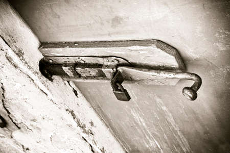 Closure of an old wooden door - safety concept imageの写真素材