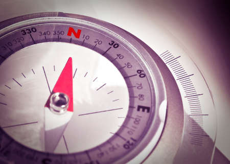 Follow your direction - concept image with navigational compass on bright backgroundの写真素材