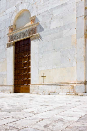 Entrance of the romanesque church of San Lorenzo (Italy - Lucca)の写真素材