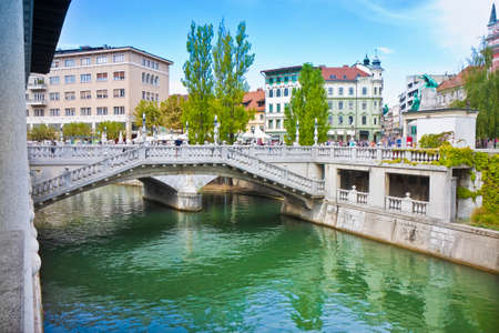 The famous "Triple Bridge" on Ljubljanica river (Ljubljana city center - Slovenia - Europe) - People are not recognizable.の写真素材