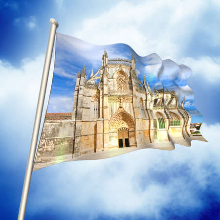 The facade of Batalha cathedral in Portugal (Europe) - 3D render flag concept against a blue sky - I'm the copyright owner of the images used in this 3D render.の写真素材
