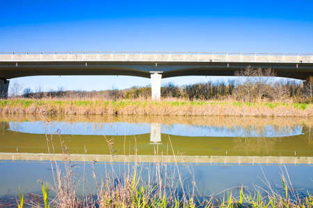 Elevated highway built built along a river with reinforced prefabricated concrete structure (Italy)の写真素材