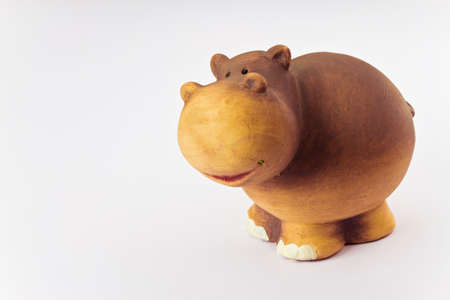Ceramic hippopotamus toy isolated on white background - image with copy spaceの写真素材