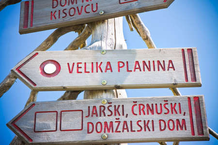 Wooden signpost to the famous place called Velika Planina.Velika Planina, which in Slovenian means...