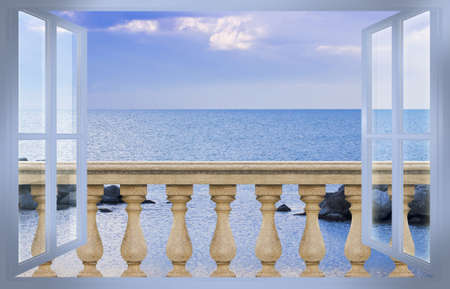 Concrete italian balustrade against a calm sea in a sunny day - concept image seen from a windowの写真素材