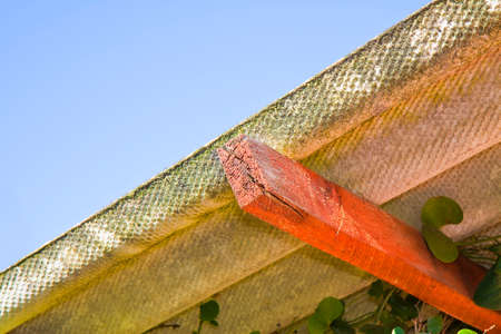 Wooden shack with a dangerous asbestos roofの写真素材