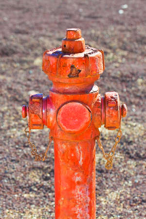 Old red rusty hydrant no longer in use.の写真素材