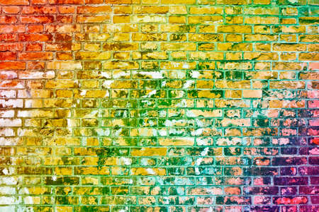 Colorful old brick wall background with rainbow effect.の写真素材