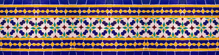 Composition of typical maroccan wall decorations with colored ceramic tiles called azulejos with a...
