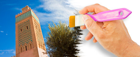 The most important mosque in Marrakech called Kutubiyya or Koutoubia, with the ancient minaret (Africa - Morocco) - concept image with hand and brush.のeditorial素材