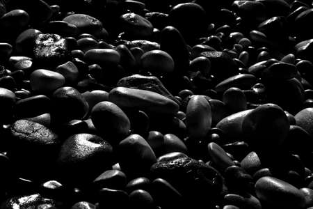 Background with black stones softly rounded - toned imageの写真素材